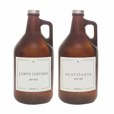 2 botellones de vidrio color ambar con etiquetas blancas jabon liquido y suavizante